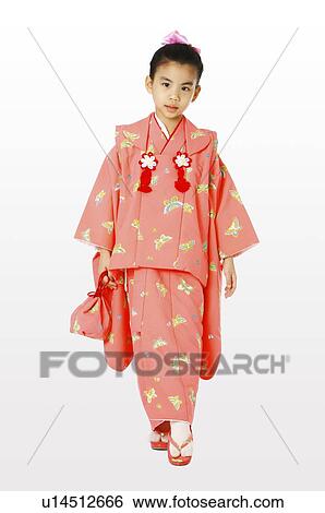 Stock Photograph - Girl in kimono putting her tiptoe on the floor. Fotosearch