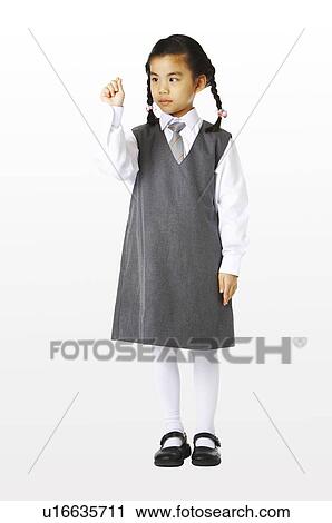 Girl in school uniform raising her arm View Large Photo Image Stock Image - Girl in school uniform raising her arm. Fotosearch