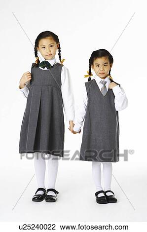 Stock Image - Girl in school uniforms. Fotosearch