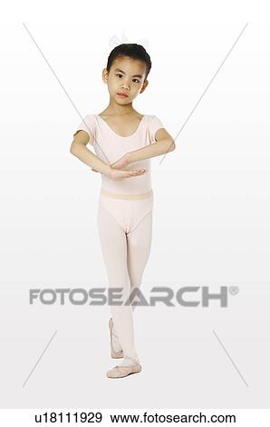 Stock Photo - Girl in sports clothing performing gymnastic. Fotosearch