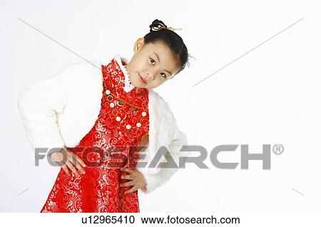 Girl in traditional dress putting her hands on her lumber View Large Photo Image Stock Image - Girl in traditional dress putting her hands on her lumber. Fotosearch