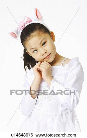 Stock Photograph - Girl posing askew head gesture. Fotosearch