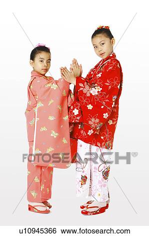 Girls in kimono crossing their hands View Large Photo Image Stock Photograph - Girls in kimono crossing their hands. Fotosearch