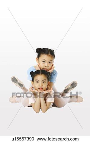Stock Image - Girls lying on the front. Fotosearch