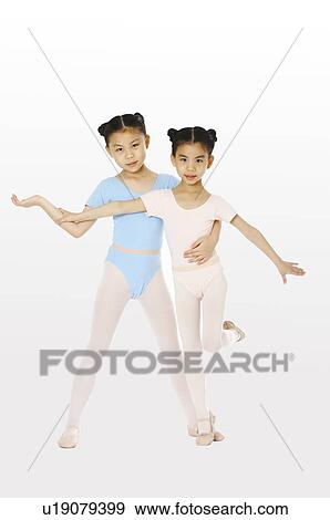 Stock Photo - Girls performing gymnastic in doors. Fotosearch