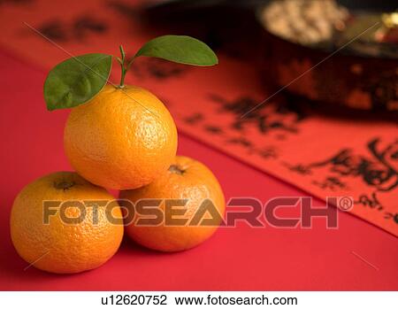 Three objects, spring festival couplets, oriental culture, orange, candy, Day View Large Photo Image Stock Image - Three objects, spring festival couplets, oriental culture, orange, candy, Day. Fotosearch