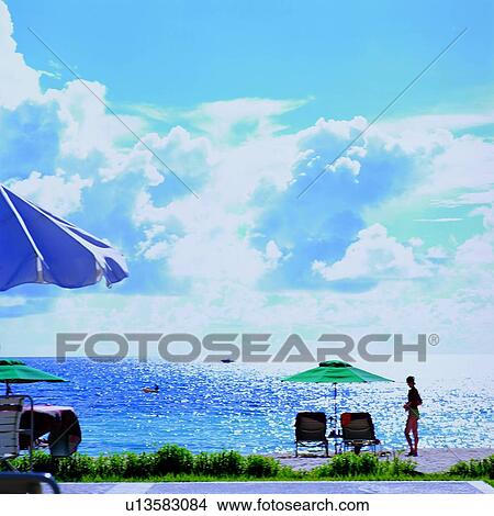 Boat, Beach umbrellas, Beach umbrella, Couches, Water, Blue sky, Boats View Large Photo Image Picture - Boat, Beach umbrellas, Beach umbrella, Couches, Water, Blue sky, Boats. Fotosearch