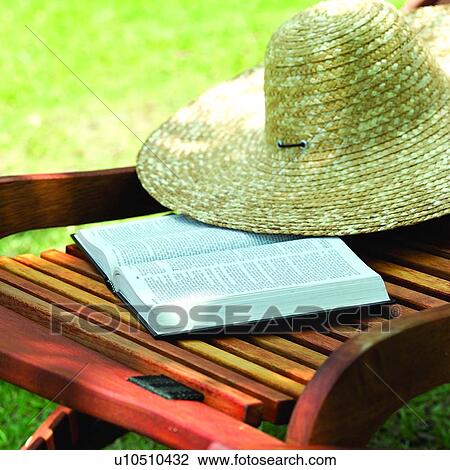 Stock Image - Couch, Straw hat, Books, Summer Splash, Straw hats, Book, Couches. Fotosearch