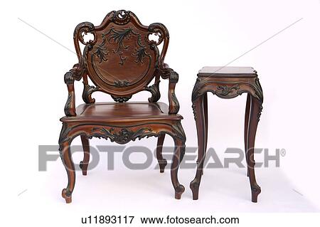 Stock Photo - Wooden armchair and coffee table. Fotosearch
