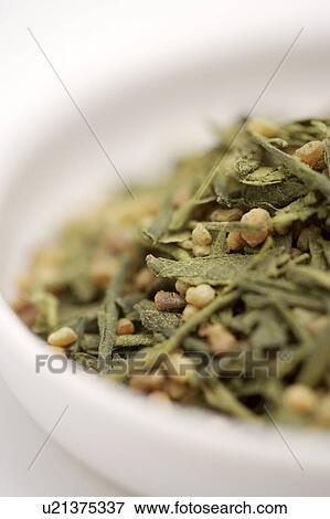 Stock Photo - Genmaicha Tea in white plate. Fotosearch