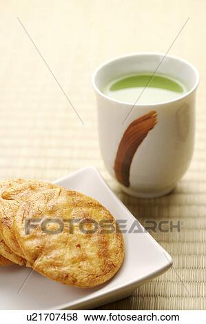 Stock Photo - Japanese Rice Crackers and Green Tea. Fotosearch