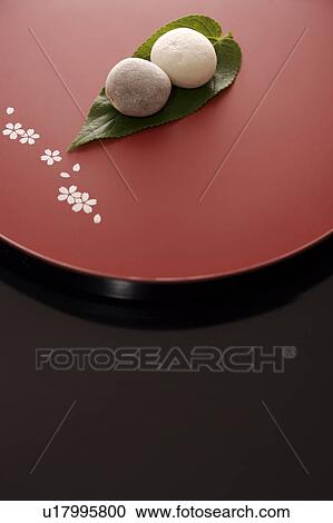 Stock Image - Sticky rice cake (mochi) display on tray. Fotosearch