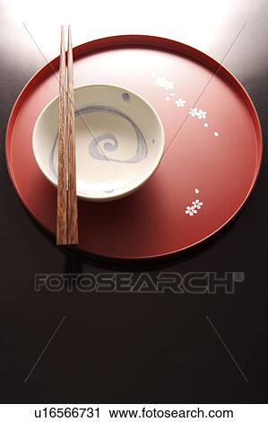 Stock Image - Still life with a bowl, plate and chopsticks. Fotosearch