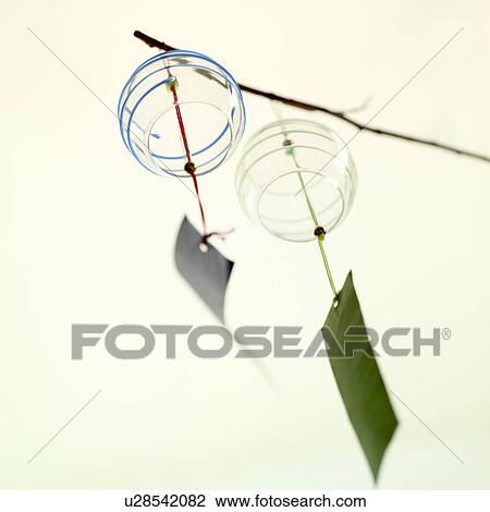 Stock Image - Wind bells hanging on a branch. Fotosearch