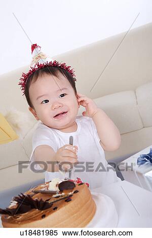 Baby boy eating birthday cake View Large Photo Image Stock Photography - Baby boy eating birthday cake. Fotosearch
