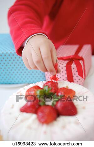 Hands holding birthday candle View Large Photo Image Stock Image - Hands holding birthday candle . Fotosearch