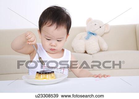 Baby boy about to eating cake View Large Photo Image Stock Photo - Baby boy about to eating cake. Fotosearch