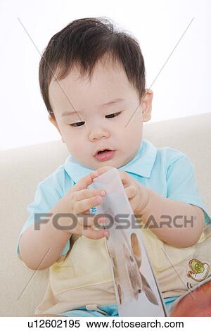 Baby boy with picture book View Large Photo Image Stock Photography - Baby boy with picture book. Fotosearch