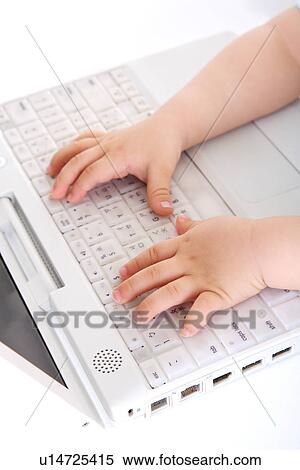 Baby touching laptop, focus on hands View Large Photo Image Stock Photography - Baby touching laptop, focus on hands. Fotosearch