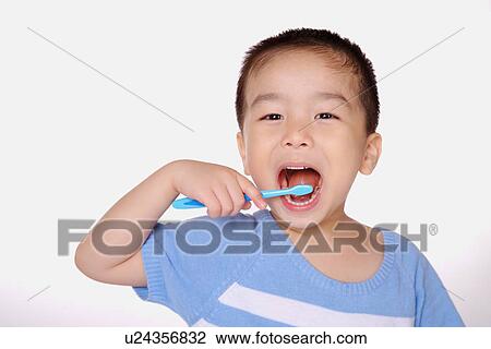 Boy brushing teeth, close up, portrait View Large Photo Image Stock Image - Boy brushing teeth, close up, portrait. Fotosearch
