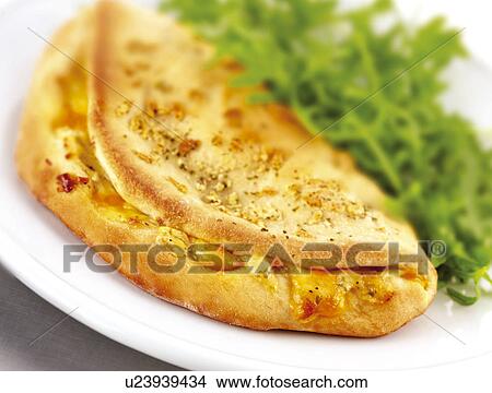 Calzone Pizza - Non Exclusive View Large Photo Image Picture - Calzone Pizza - Non Exclusive. Fotosearch