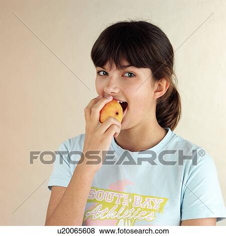Stock Photo - Child eating pear. Fotosearch
