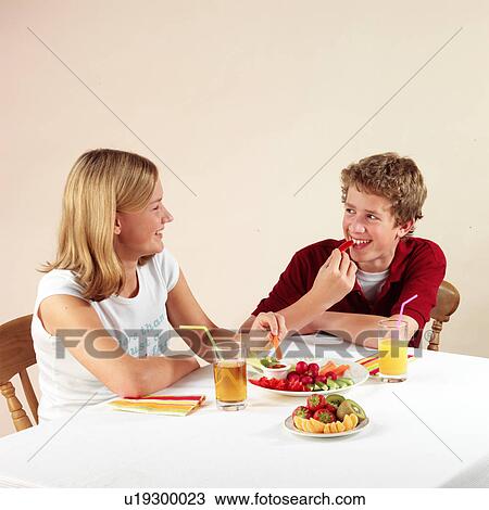 Children eating and drinking View Large Photo Image Stock Image - Children eating and drinking. Fotosearch