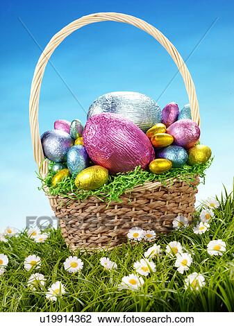 Stock Image - Chocolate Eggs in Basket - Non Exclusive. Fotosearch
