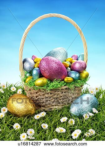Stock Photo - Chocolate Eggs in Basket - Non Exclusive. Fotosearch