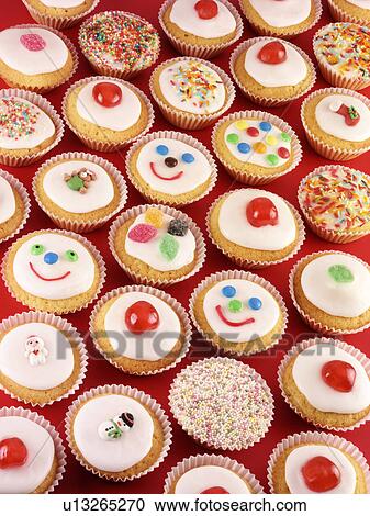 Cupcakes on Red - Non Exclusive View Large Photo Image Stock Image - Cupcakes on Red - Non Exclusive. Fotosearch
