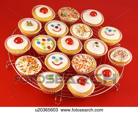 Stock Image - Cupcakes on Red - Non Exclusive. Fotosearch