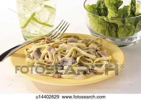 Fettuccine and salad View Large Photo Image Stock Photo - Fettuccine and salad. Fotosearch