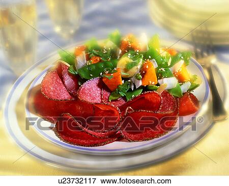 Stock Photo - German salami and salad. Fotosearch