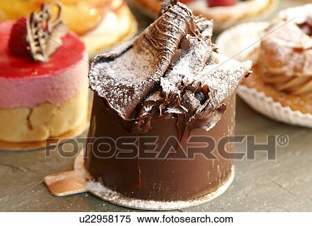 Stock Photography - Individual Chocolate Mousse and selection of Individual Cakes. Fotosearch