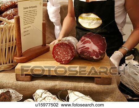 Stock Image - Market stall with Italian antipasto platter. Fotosearch