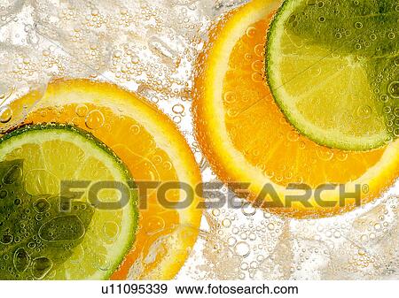 Stock Photo - Orange and lime slices. Fotosearch