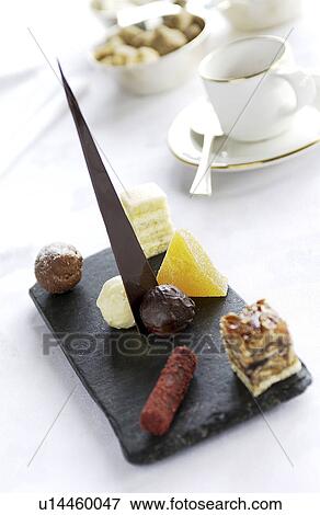 Stock Photo - Petit fours on slate. Fotosearch