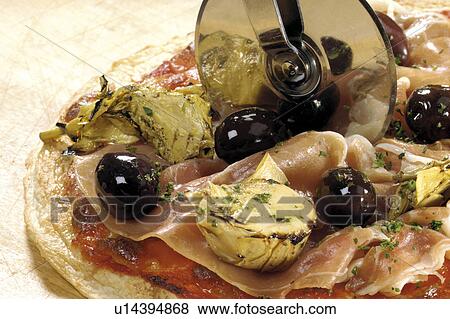 Stock Photo - Pizza and cutter. Fotosearch