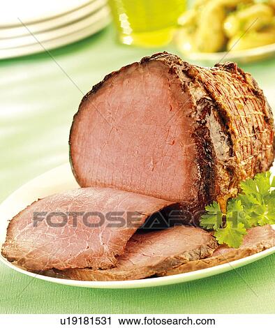 Stock Image - Roast Beef On Table - Non Exclusive. Fotosearch