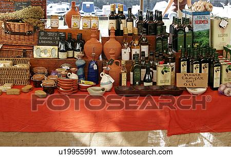 Stock Image - Selection of oils and vinegars on market stall. Fotosearch