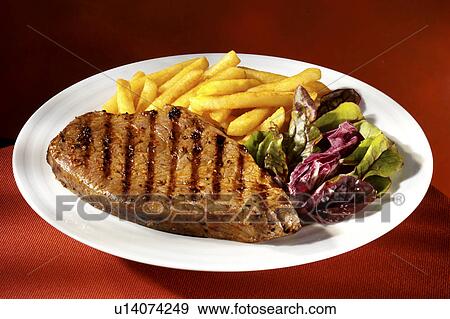 Stock Photo - Steak Fries And Salad - Non Exclusive. Fotosearch