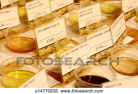 Stock Image - tasting pots of olive oils and vinegars. Fotosearch