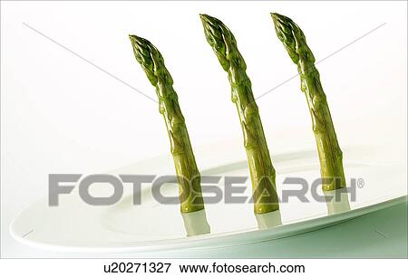 Stock Photo - Three standing asparagus spears. Fotosearch