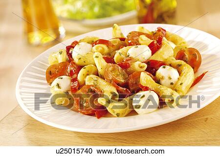 Stock Image - Tomato, mozzarella and pasta salad. Fotosearch