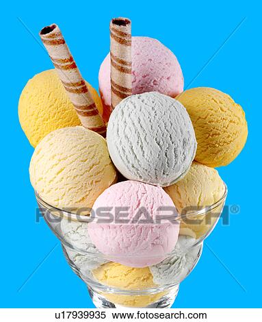 Stock Photography - Vanilla Ice Cream Cone on Blue - Non Exclusive. Fotosearch