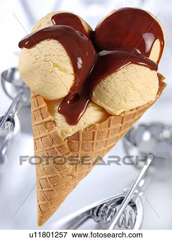Stock Photo - Vanilla Ice Cream Cone With Chocolate Sauce - Non Exclusive. Fotosearch