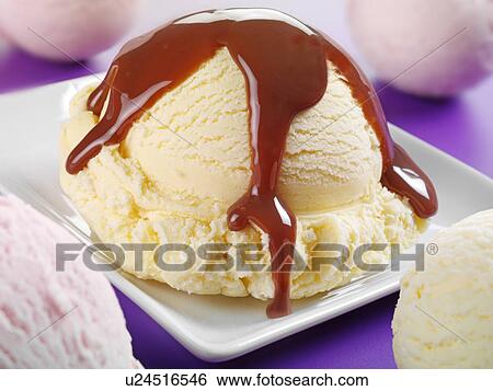 Stock Photograph - Vanilla Ice Cream With Chocolate Sauce - Non Exclusive. Fotosearch