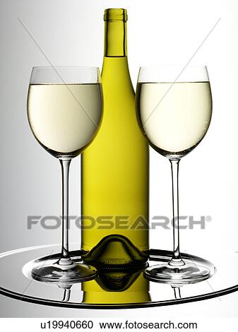 Stock Image - White Wine Glasses And Bottle - Non Exclusive. Fotosearch