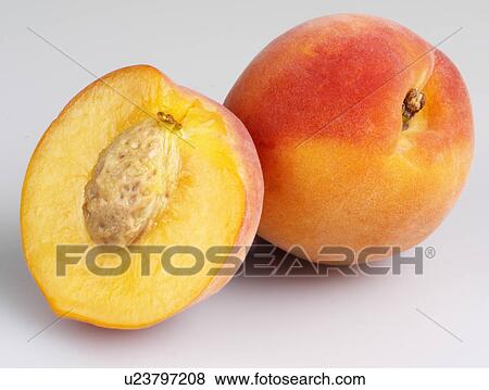 Stock Photo - Whole Peach and Half - Non Exclusive. Fotosearch