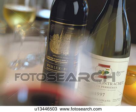Wine bottle through a glass View Large Photo Image Stock Image - Wine bottle through a glass. Fotosearch